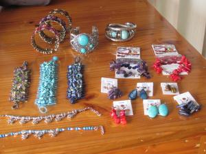 Lots of fancy and really 'cheap' jewellery. Note the large, chunky bracelets!
