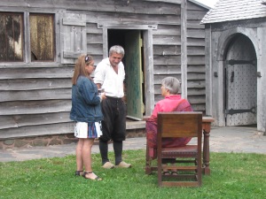 Inside the Habitation with  Mr. Melanson, an Acadian guide, dressed in period costume.