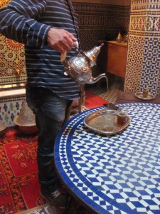 Out host pouring us some mint tea.