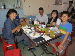 Mr. Long with mother, Trinh and her daughter and son, two of Long's student's.