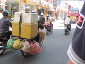 There is a motor bike under there.